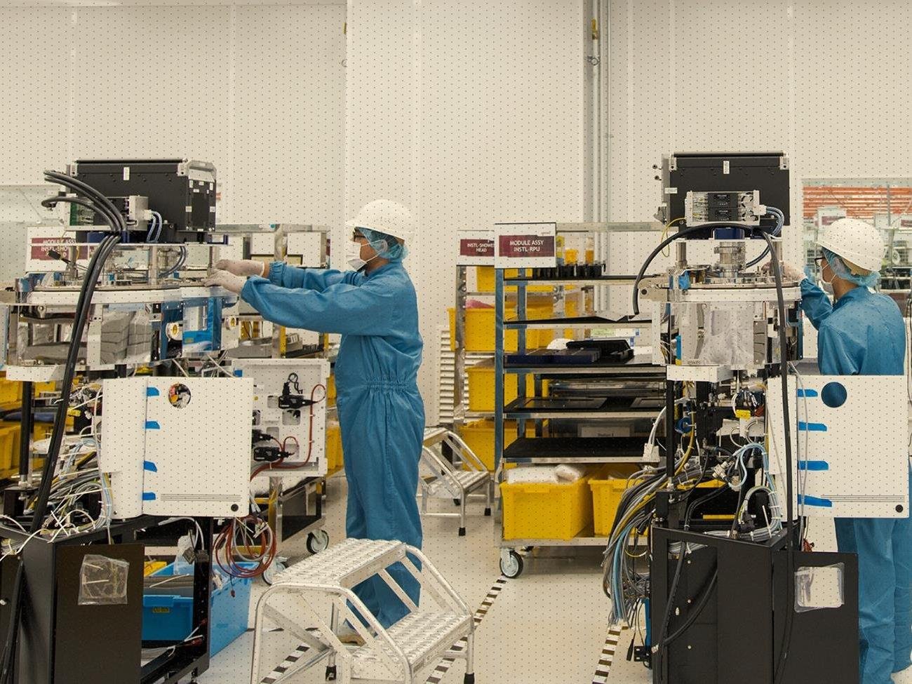 Worker building Semiconductor Capital Equipment