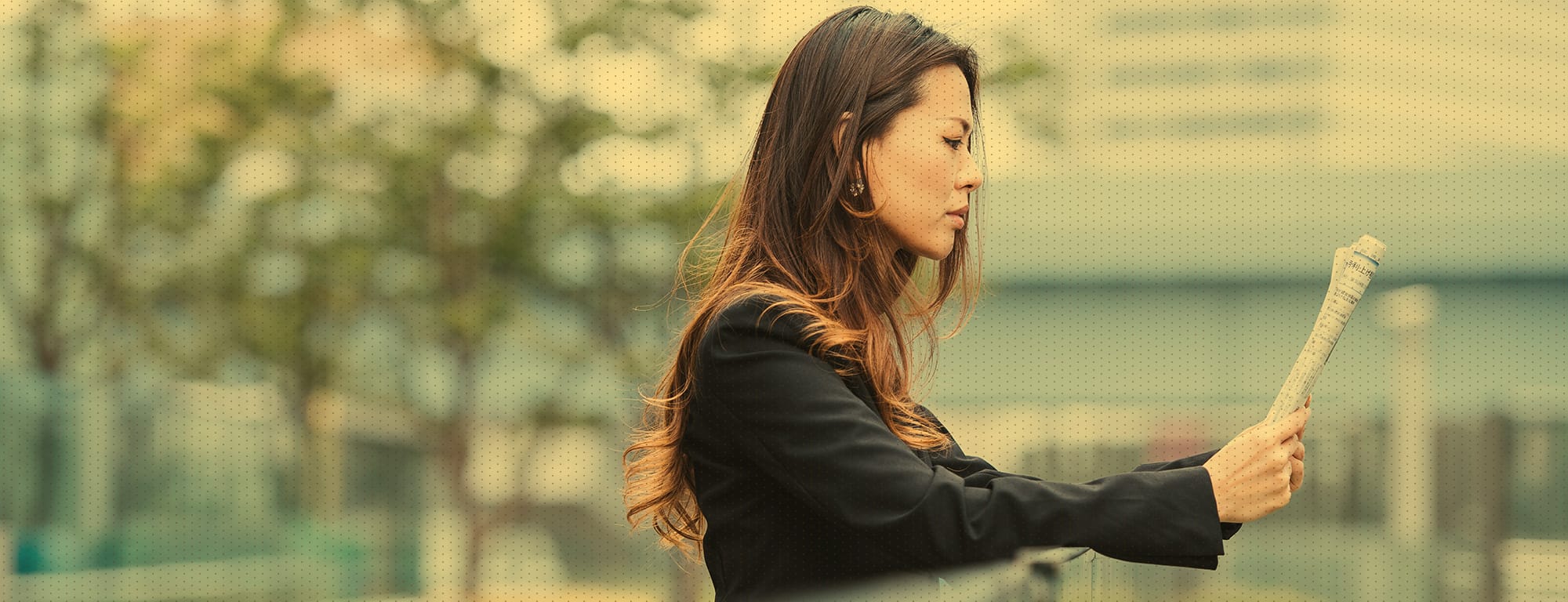 Female reading a newspaper