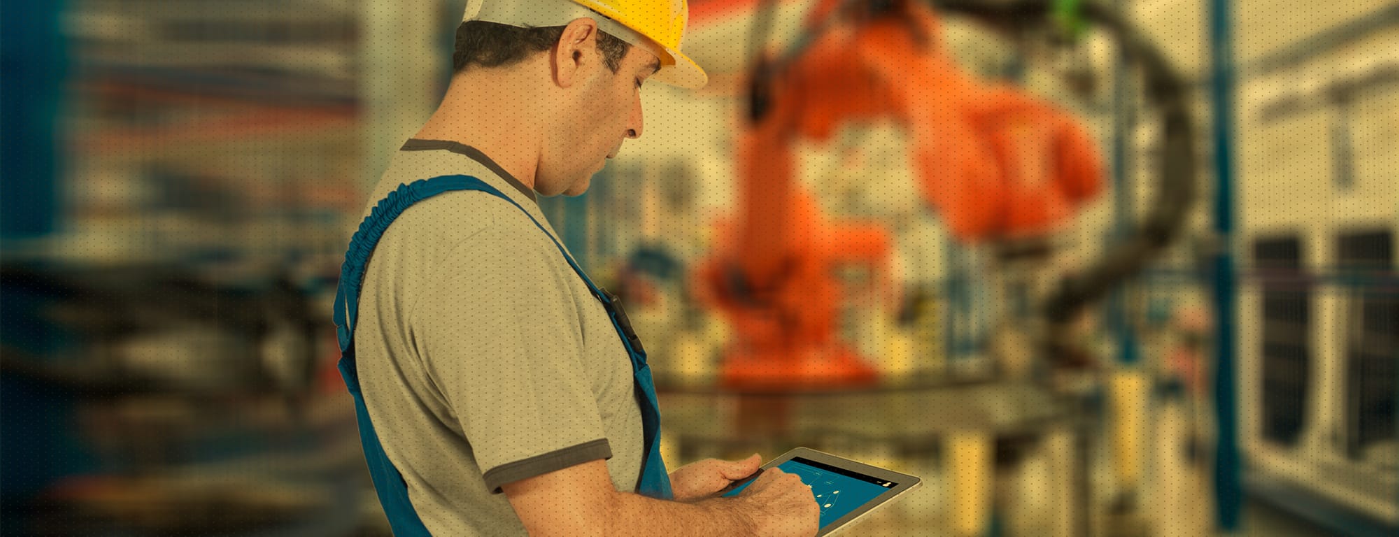 Man with yellow hard hat working in manufacturing plant