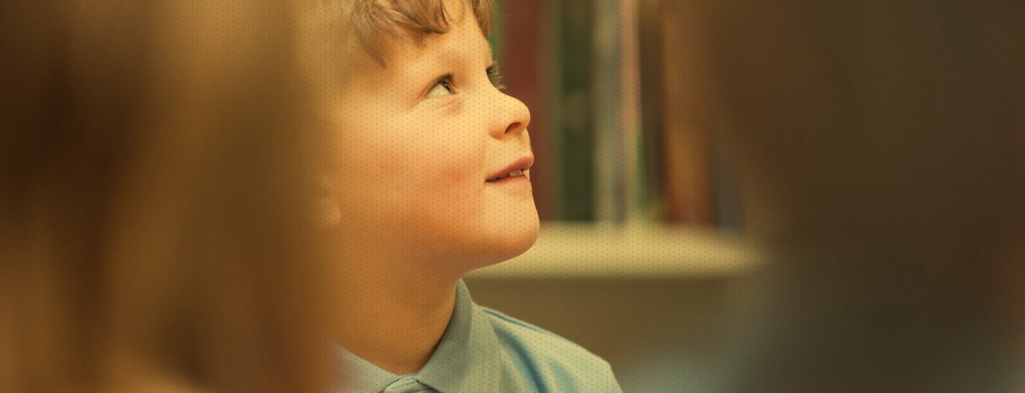 Little boy looking up and smiling
