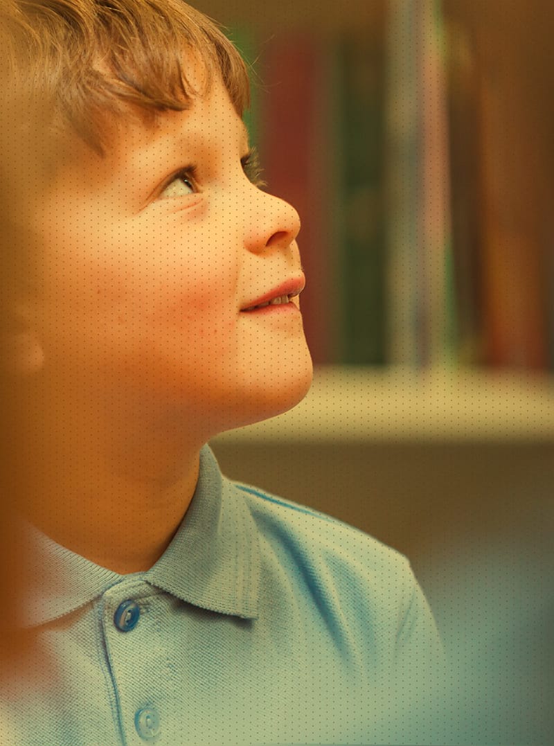 Little boy looking up and smiling