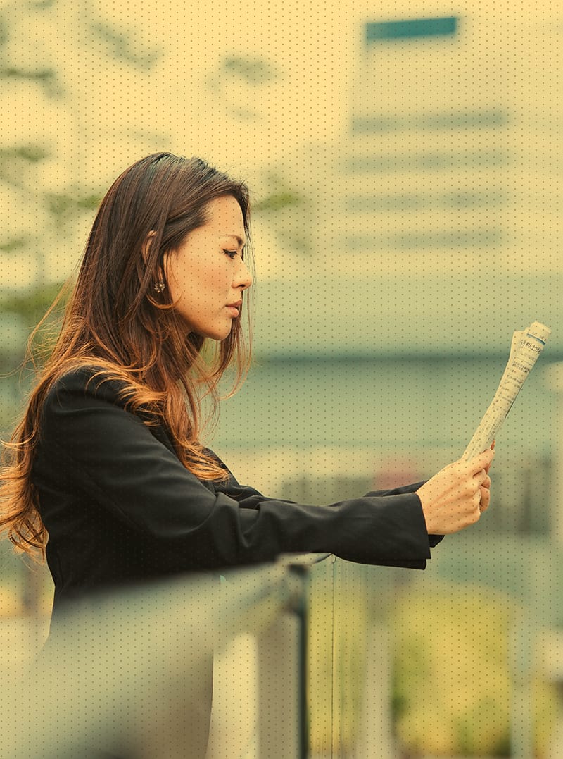 Female reading a newspaper