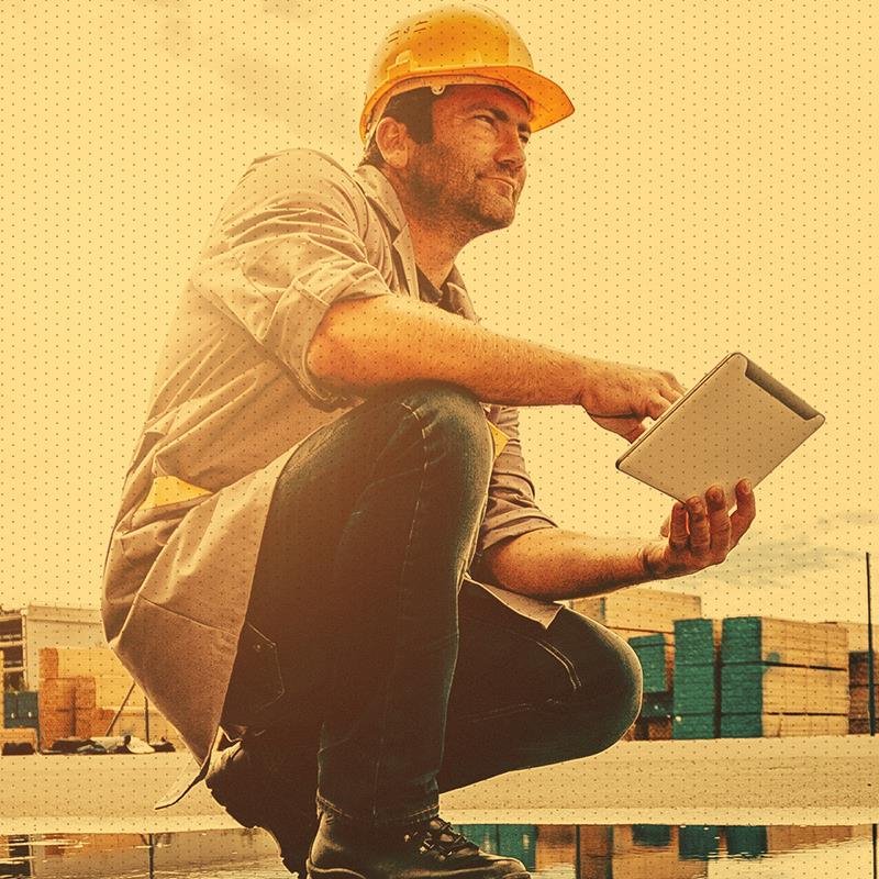 Construction man looking at tablet at work
