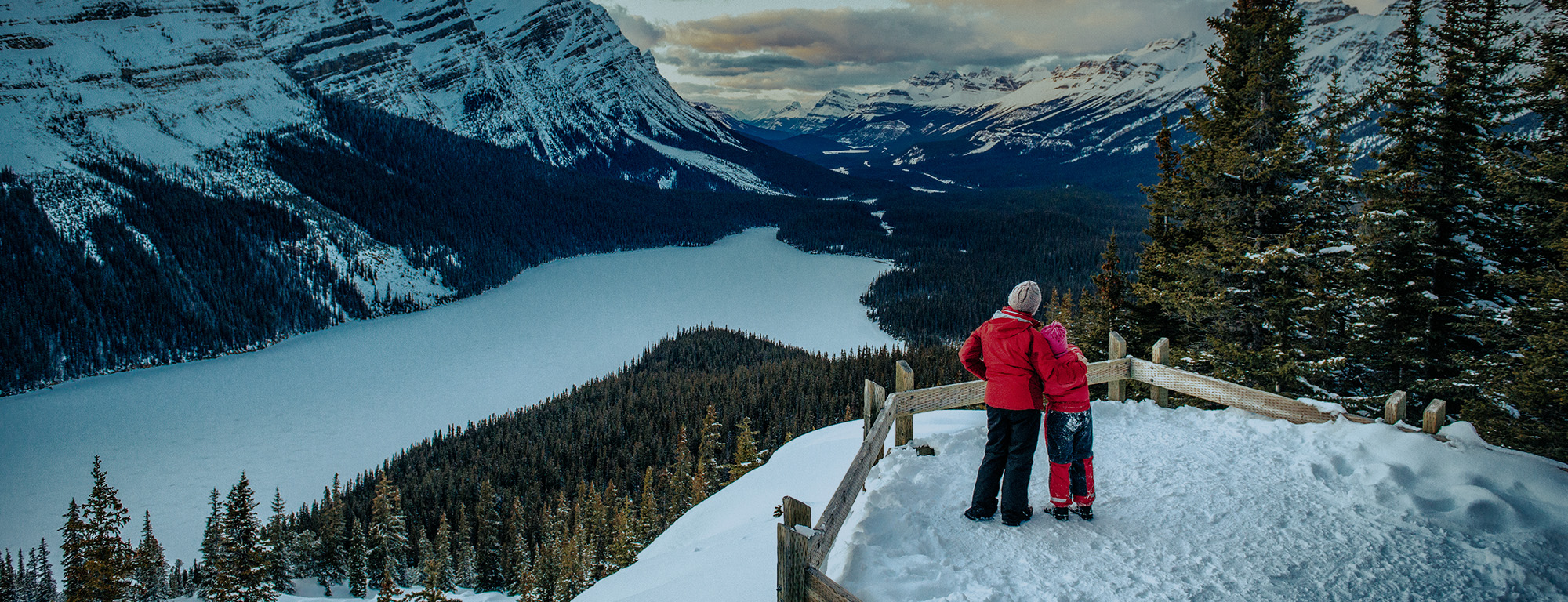 parent and child overlooking mountains