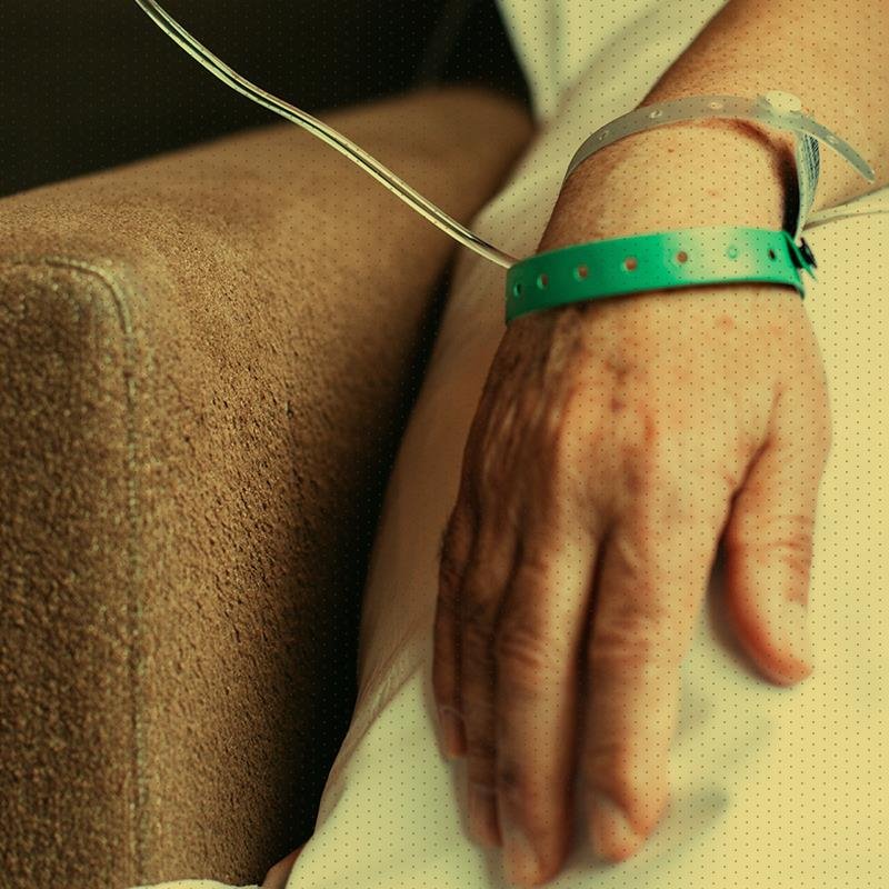 Hand with medical tube attached
