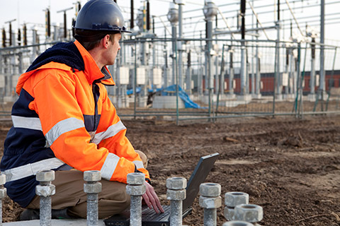 Electrician working on electrical grid