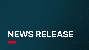 A graphic with a dark teal background features the bold white text "NEWS RELEASE" above a red tag, with a geometric pattern of connected dots in the lower right corner.
