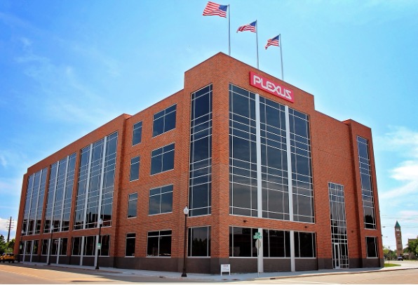 A building with a red brick facade and a Plexus sign on the front, identified as the Plexus Neenah Design Center in the United States.