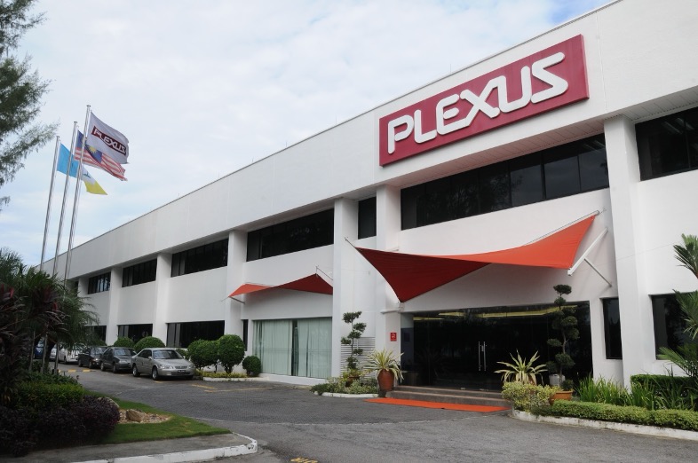 A building with a white facade and a Plexus sign on the front, identified as the Plexus Penang Seaside site in Malaysia.