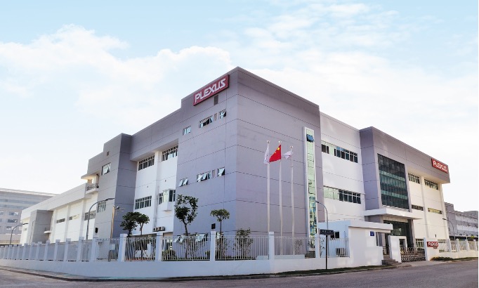 A modern building with a gray and white facade and a Plexus sign on the front, identified as the Plexus Xiamen 2 site in China.