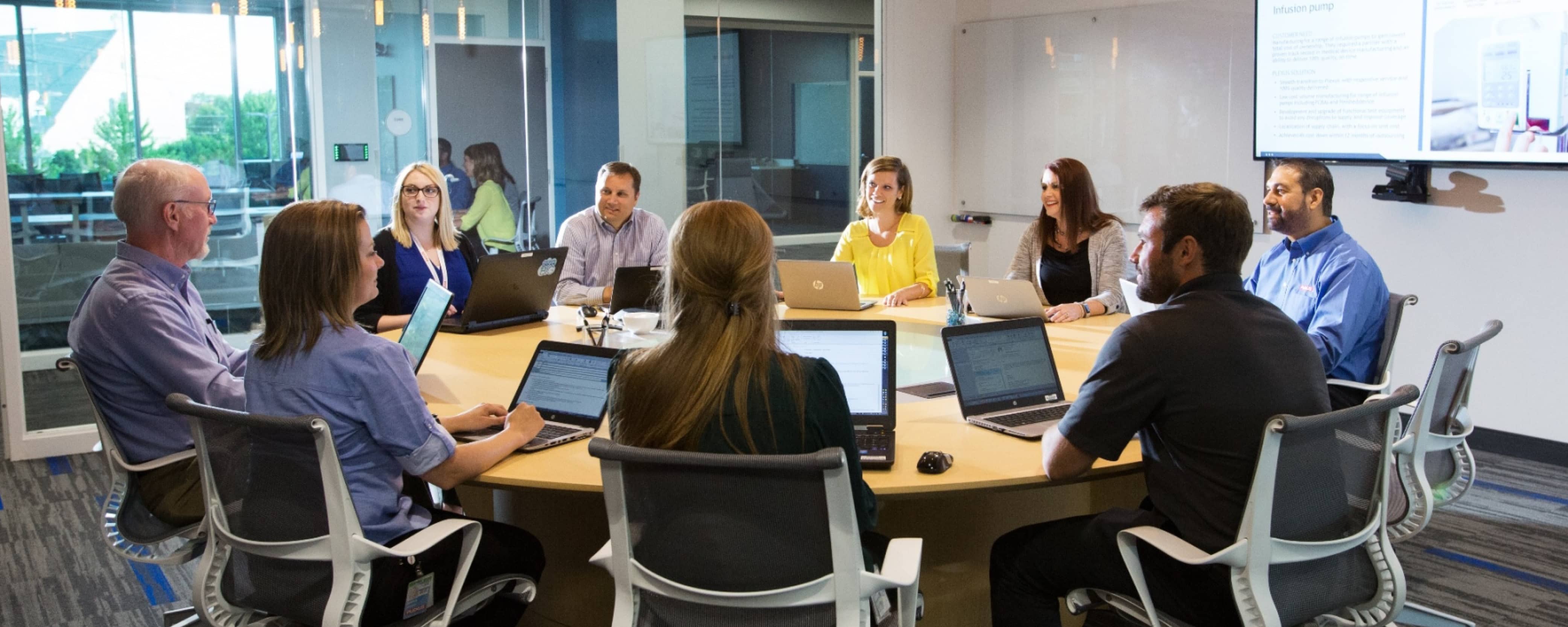 business people talking around a conference table