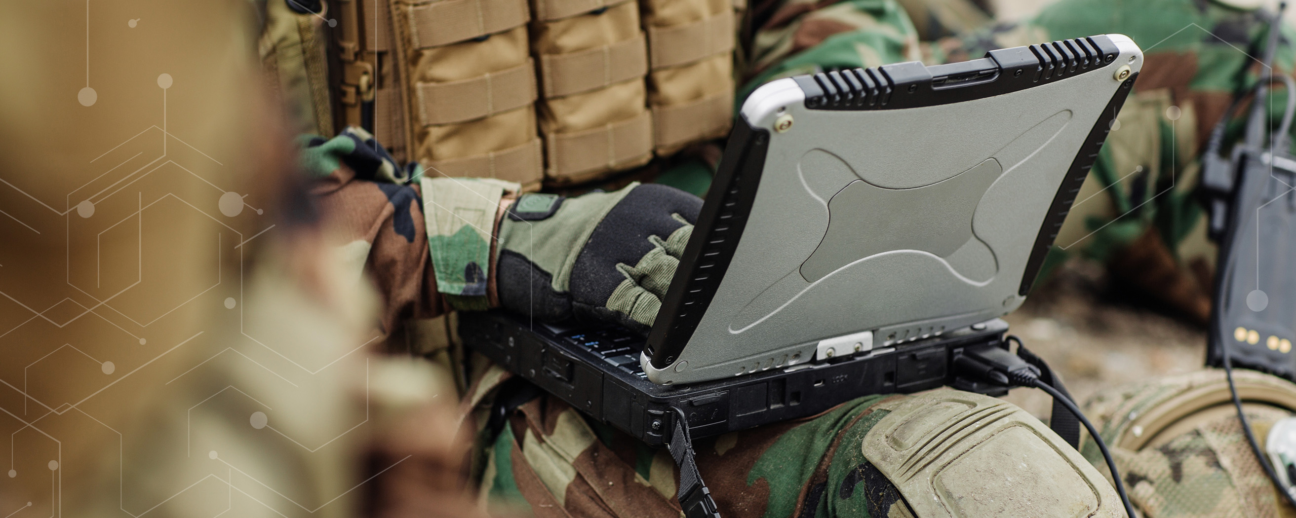 soldier working on a heavy duty computer