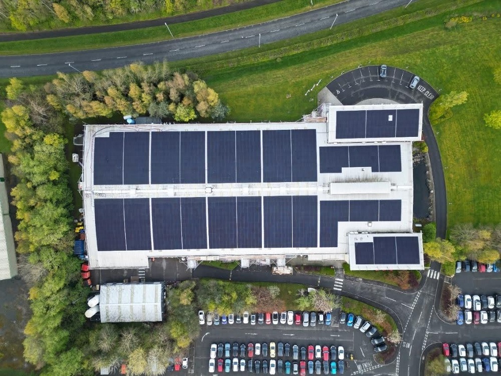 Aerial view of the Plexus Kelso site, featuring solar panels on the roof and recycling bins visible to the left of the building.