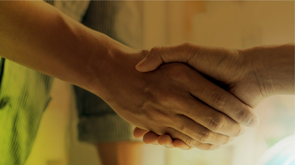 A close-up of two people shaking hands
