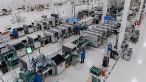 A professional, wide-angle shot of a clean and modern electronics manufacturing facility.